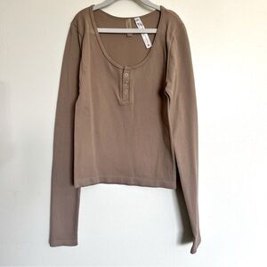 Long Sleeve Henley top with Button Down Front and Scoop Neck.